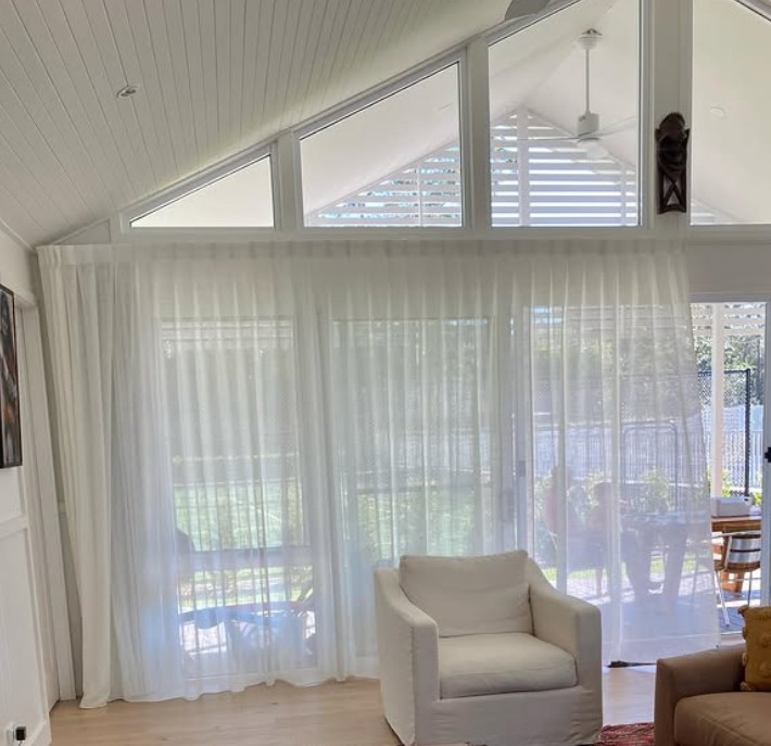 Curtains 1. A simple fresh look with beautiful white sheers adding blockout lining behind giving them the privacy they require while still seeing the beautiful gardens.